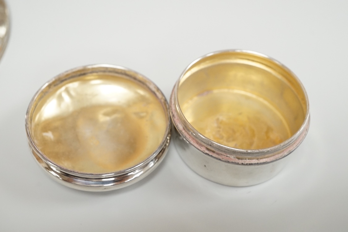 A George V silver mounted capstan inkwell, A & J Zimmerman Ltd, Birmingham, 1913, diameter 11.4cm, together with a small silver bowl, a small silver 'dish ring' salt(a.f.), a silver two handled bowl, a silver pill box an